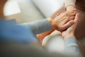 Hand embrace to represent Dialectical Behavior Therapy