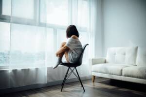 Girl on chair to represent depression